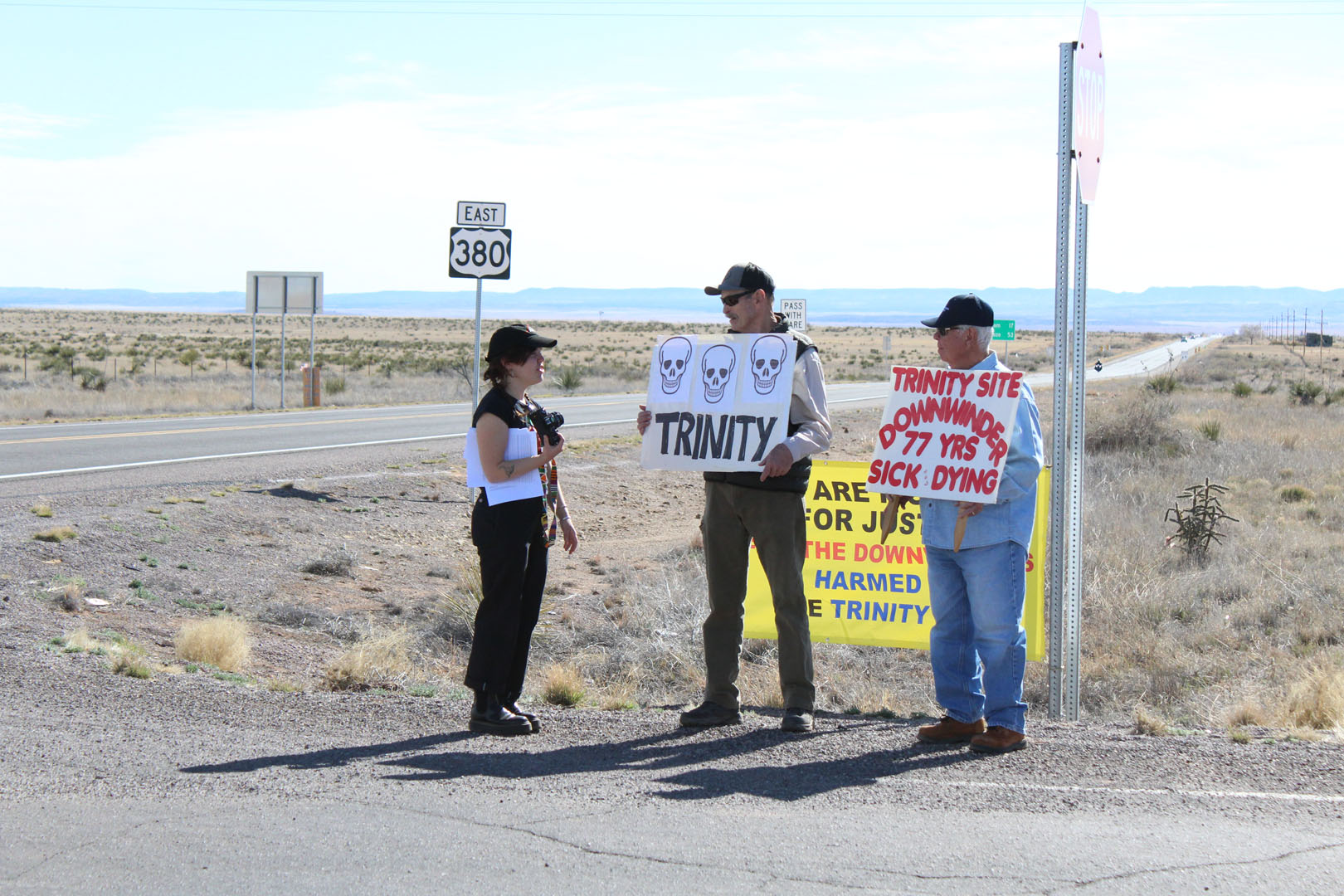 Paraprofessional Lucie Raphael '22 speaks with protestors, known as Downwinders, outside of White Sands Missile Range in March 2023. Photo submitted by Zeke Lloyd ’24.